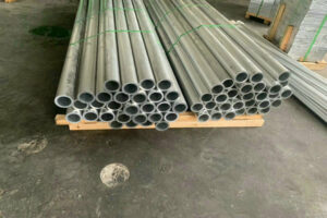5083 marine-grade aluminum tubes stacked on wooden pallets at HXM Aluminum warehouse