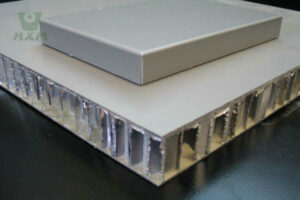 Finished aluminum honeycomb panels with sealed aluminum edges stacked for export from HXM Aluminum