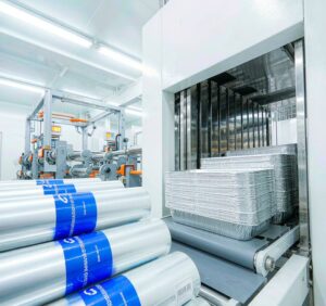 Aluminum foil roll and food containers in clean food processing factory