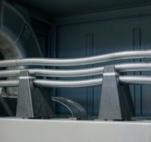 Aluminum busbar bars in electrical switchgear cabinet with insulators and connections